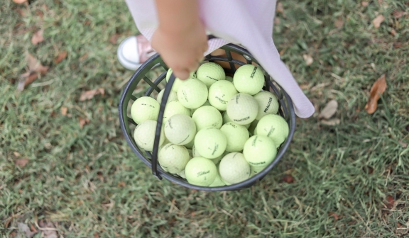 Golf balls in golf range baskets